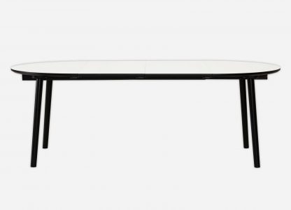 Rundt spisebord med udtræk her vist med hvid laminat, sort kant og bordben