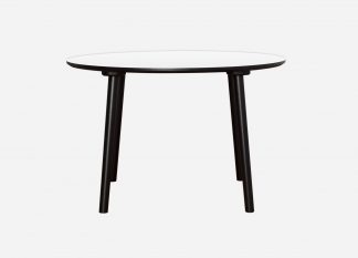Rund spisebord med hvid bordplade, sort kant og sorte bordben